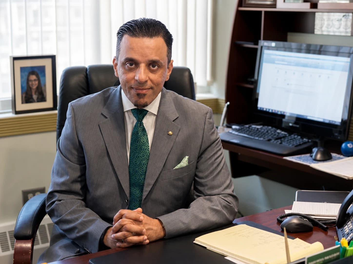 Dr. Emad Soliman seated in his office